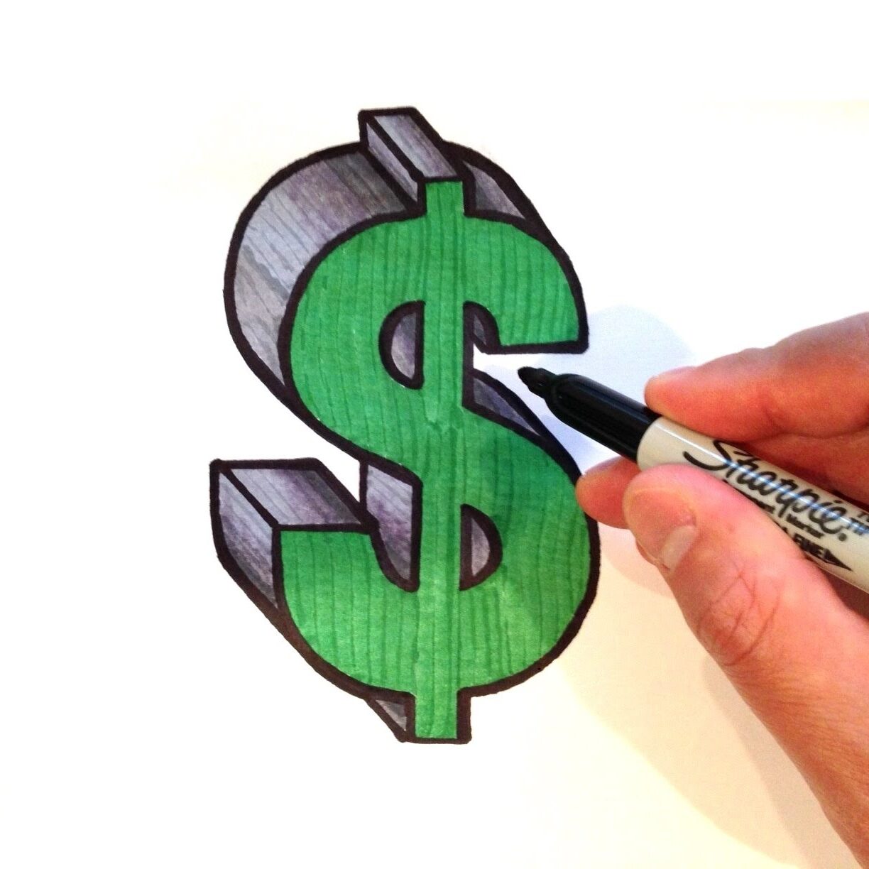 hand drawing a 3-D money symbol 
